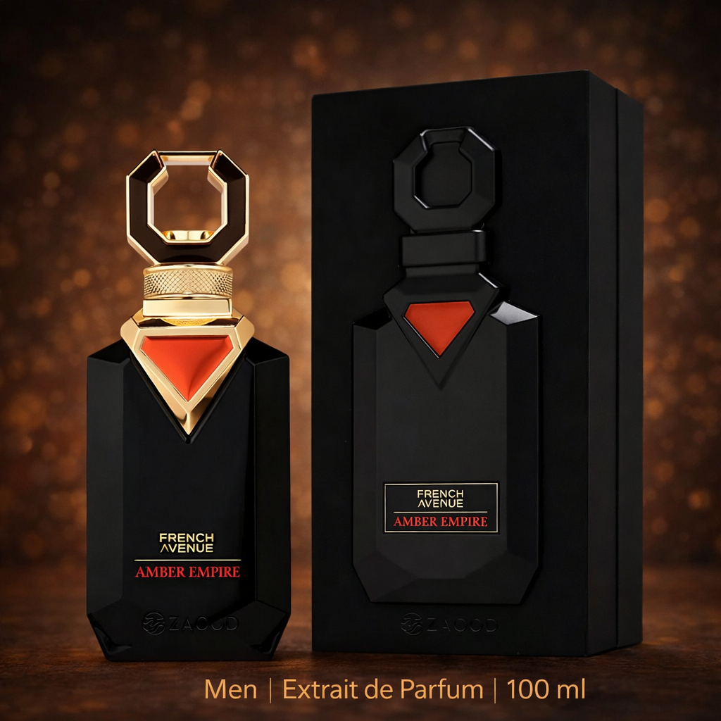 Schwarzer, eleganter Parfumflakon „Amber Empire“ von French Avenue mit goldener Verschlusskappe und rotem Dreieck-Detail, daneben die passende schwarze Verpackung – Men Extrait de Parfum, 100 ml, präsentiert vor warmem, goldenem Hintergrund.